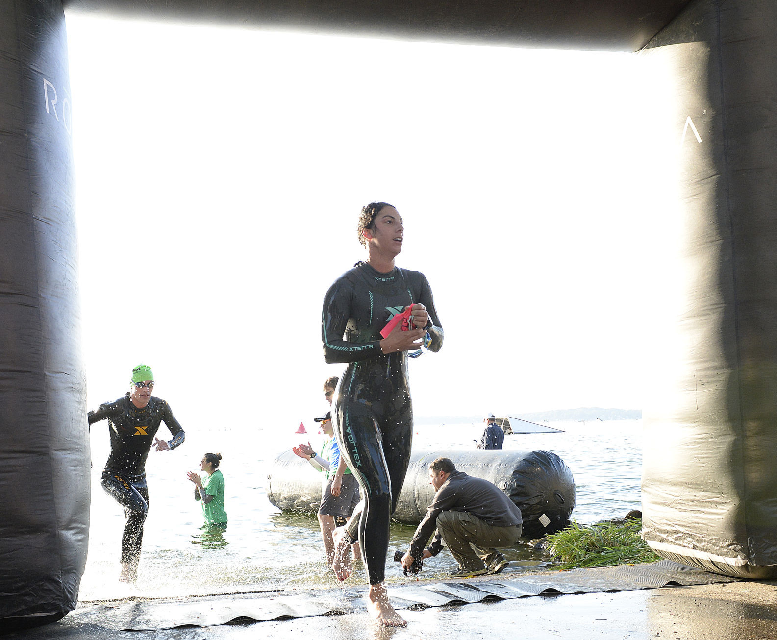 IRONMAN Athletes cross the swimming finish line